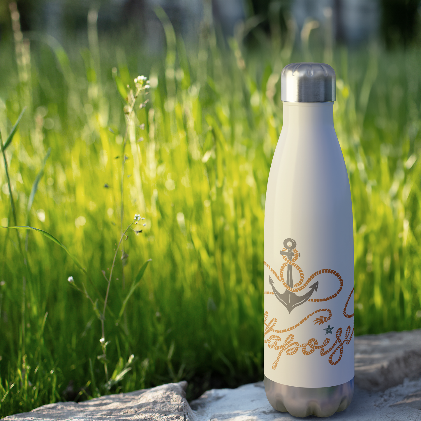 Anchored_in_Mattapoisett_Water_Bottle_WaterBottle_Outdoor_grass_Mockup.png